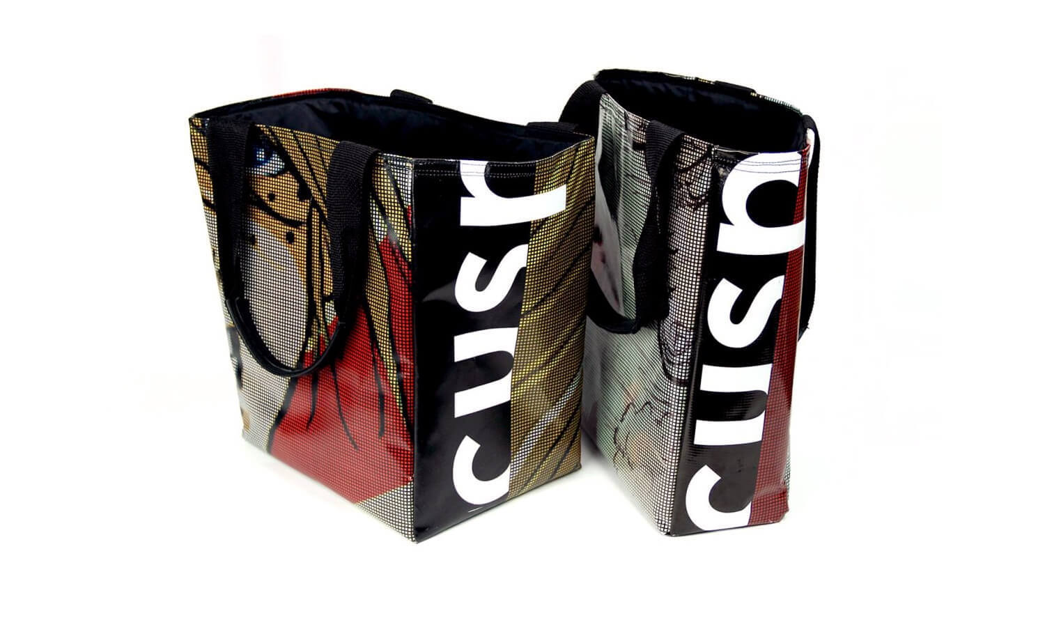 Two tote bags with pop art designs and bold black handles. Each bag features dotted patterns, a mix of colors, and large white "cusp" logo.