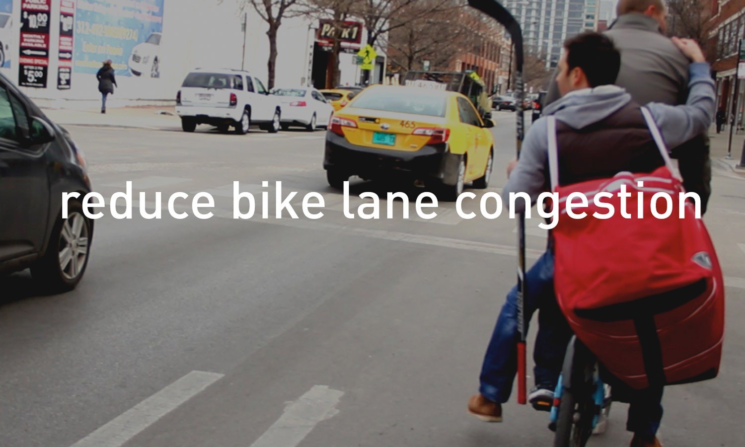 Man riding ride sharing a Dubbl bik with a red bag in a city street, passing a yellow taxi and cars, with the text "reduce bike lane congestion" overlaid.