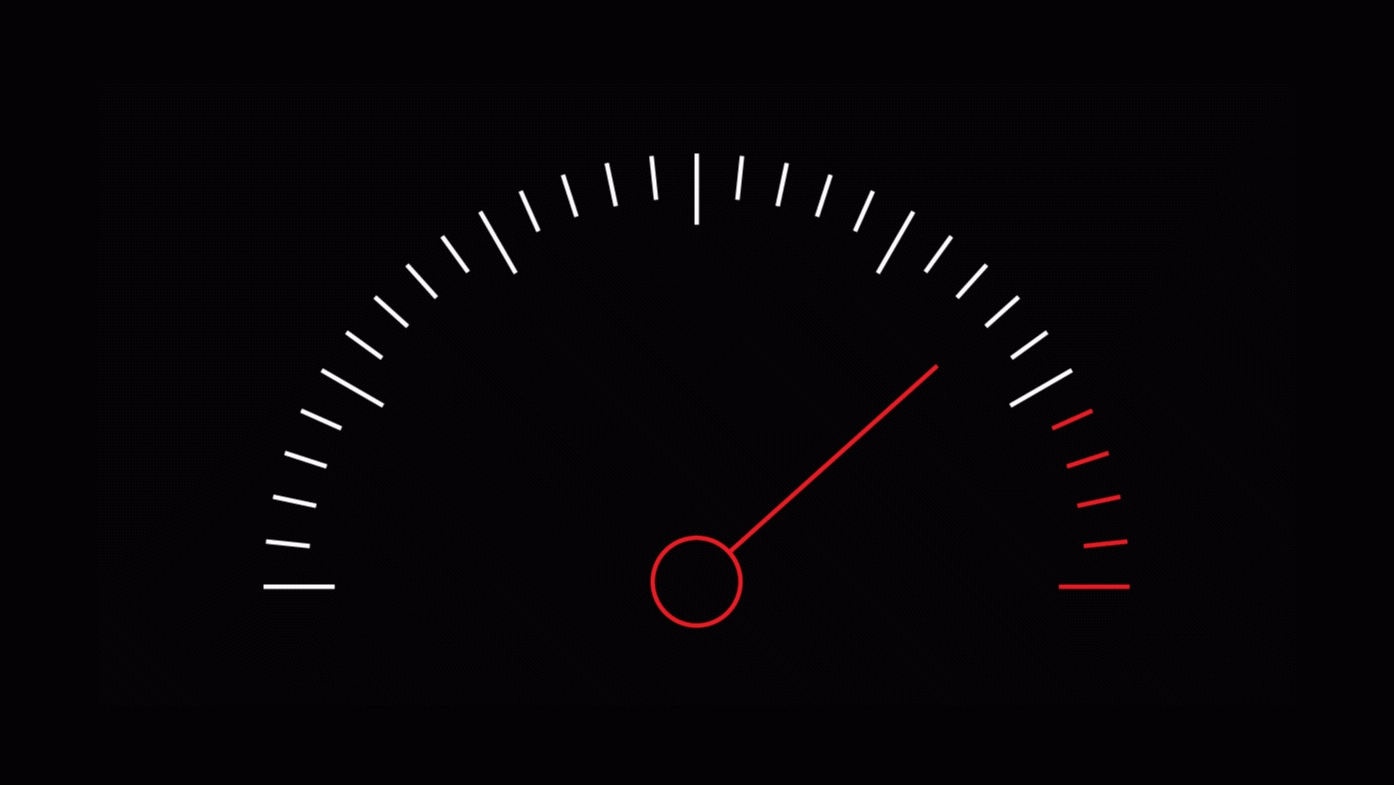 A black background with a speedometer graphic. It features white tick marks in an arc, a red needle pointing right, and red markings indicating the high range.