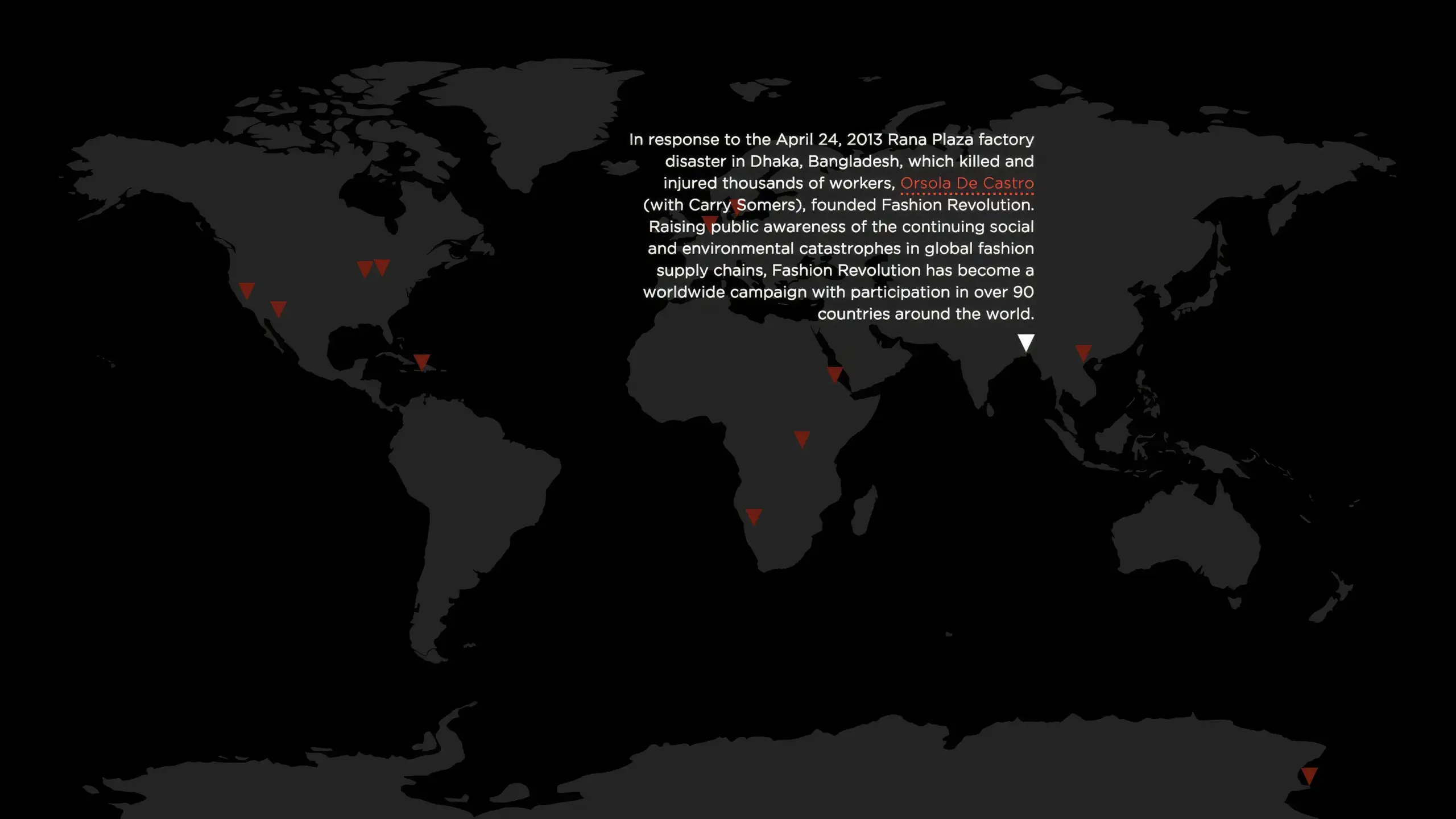 A dark world map highlighting locations with red triangles. Text details Fashion Revolution's founding in response to the 2013 Rana Plaza disaster.